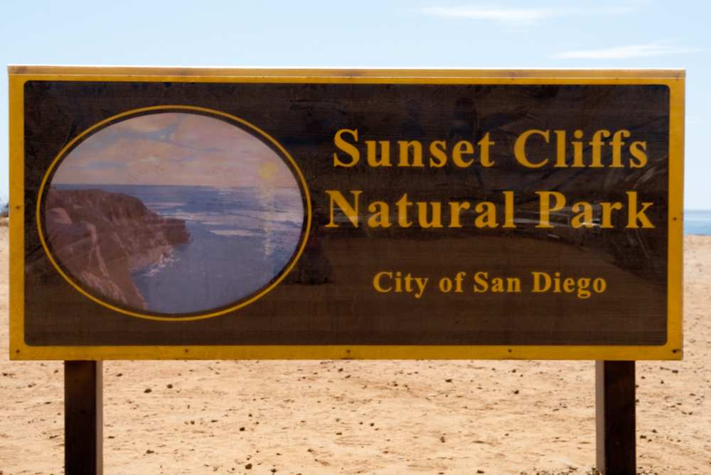 Sign that reads Sunset Cliffs Natural Park City of San Diego